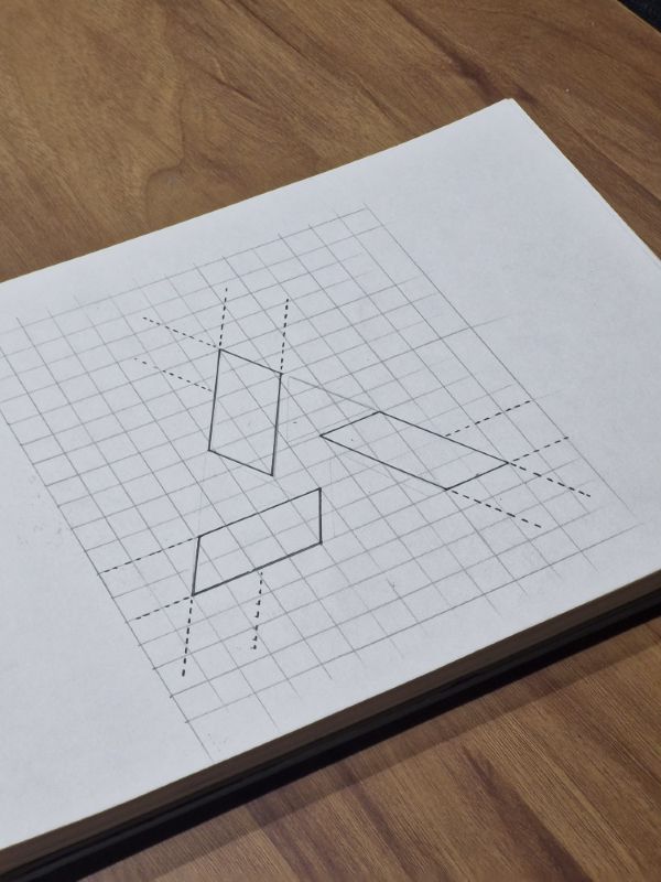 Sketchbook page with pencil parallelograms and dashed guide lines on a grid